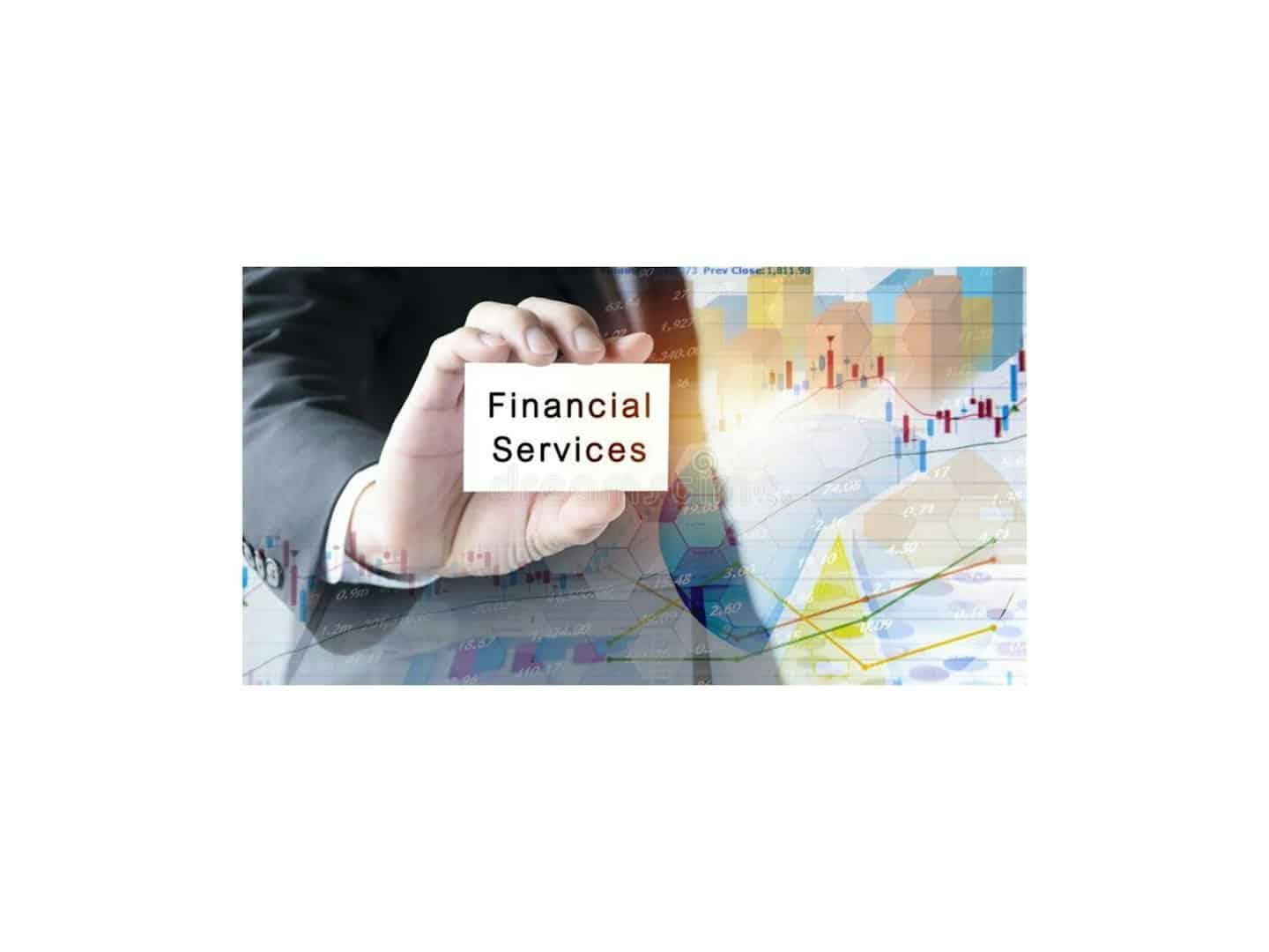 A hand in a dark suit holds a financial services card.